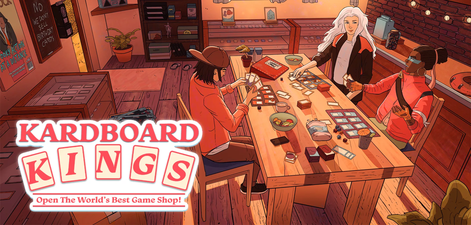 Três pessoas jogando em uma loja de jogos de cartas com vista para o mar com a logo Kardboard Kings na frente.