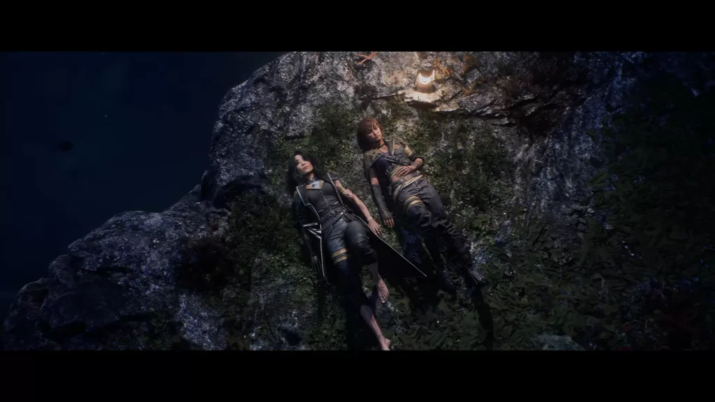 Sciel deitada na ponta de uma pedra com grama junto de outra personagem.
