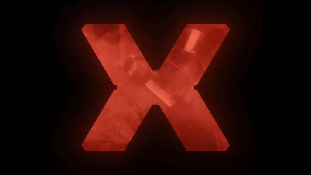 Um X cortado em fundo preto com imagem de operador de Rainbow Six em vermelho.