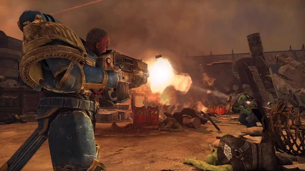 Space Marine em conflito com um Ork. em um local devastado com céu alaranjado.