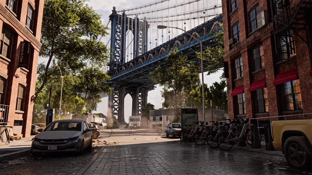 Vista para a ponte de Manhattan, com rua e vários carros e bicicletas.