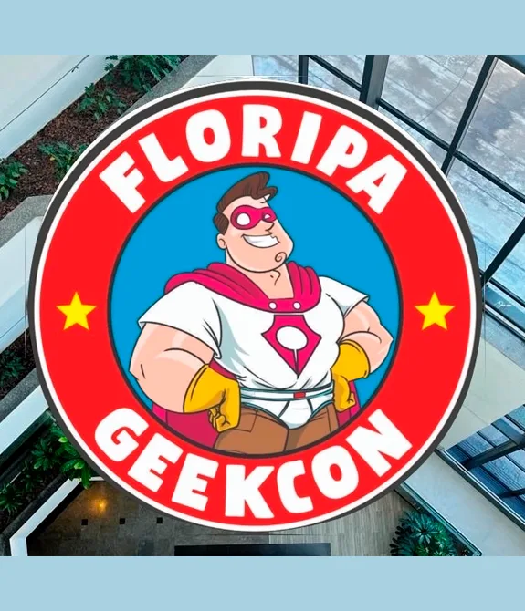 Logo da Floripa Geekcon 2026 com fundo de foto de um prédio.
